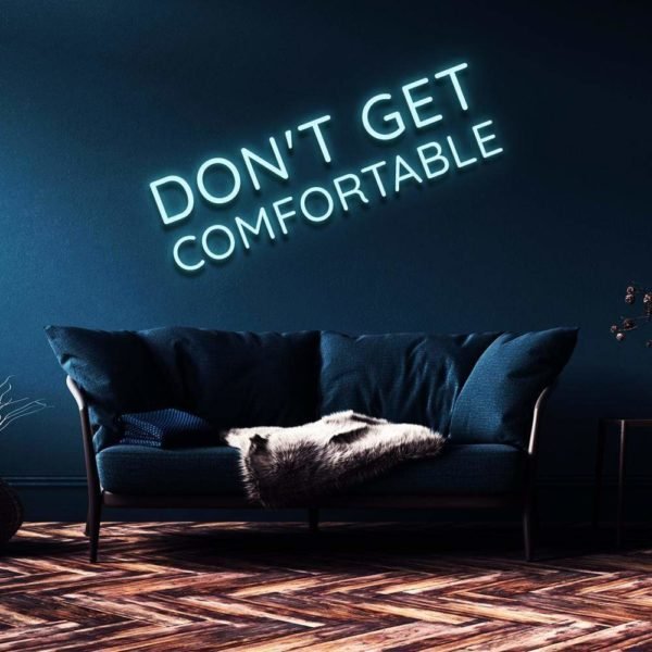 don't get comfortable neon sign