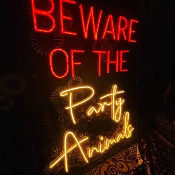 beware of the party animals neon sign
