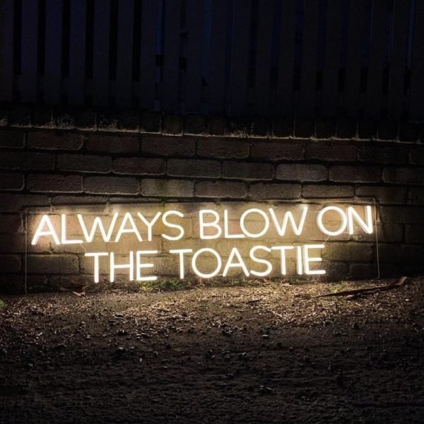 always blow on the toastie neon sign