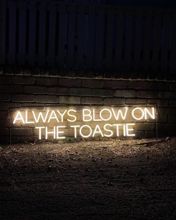 always blow on the toastie neon sign